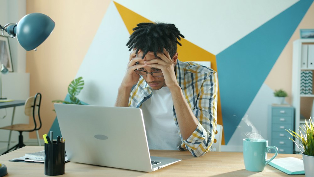 Frustrated founder at a laptop